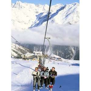 Skiers Riding Chairlift up to Slopes from Village of Solden, Tirol 