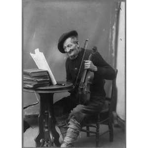 com The old violin,no. 2,old man seated at small table holding violin 