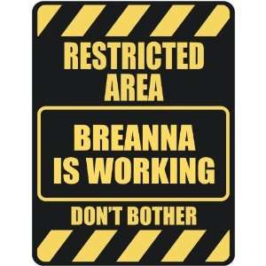   RESTRICTED AREA BREANNA IS WORKING  PARKING SIGN