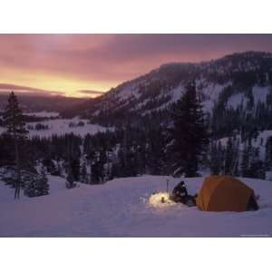 Snow Camper Eats Breakfast at Dawn in a National Forest, Sierra Nevada 