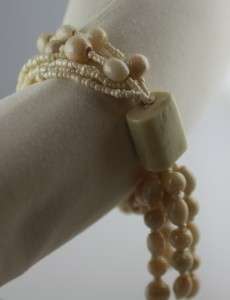 Shimmery multi strand stretch bead seed bracelet cream pearlike glass 