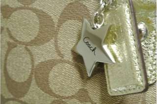 description gold leather hang tag with sliver coach star front 