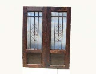 One of a kind rustic garden gates of salvaged wood and iron  