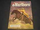 1987 Marlboro Cigarettes Ad Cowboy Raincoat Lasso