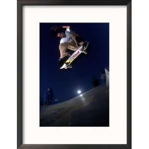  Skateboarder Doing a Maneuver in the Air Framed 