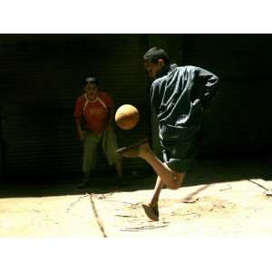 An Egyptian Boy Shows off His Ball Skill as He Plays Soccer with a 