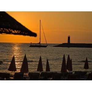 Sunset on Sailboat, Lighthouse and Umbrellas, Kusadasi, Turkey Premium 